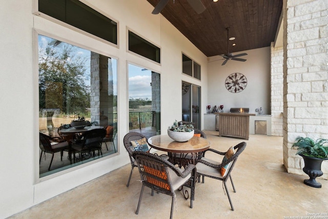 view of patio featuring area for grilling and ceiling fan