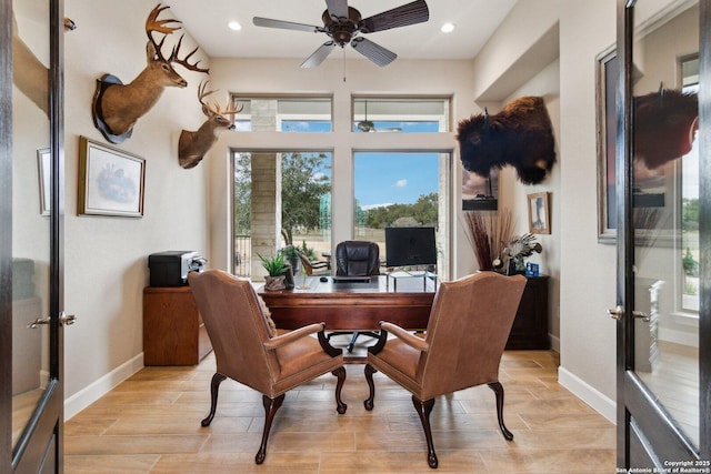 home office featuring french doors and ceiling fan