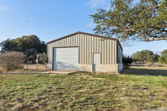 garage featuring a lawn