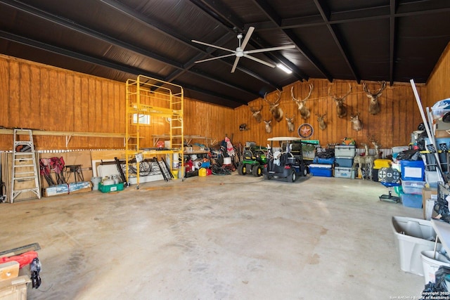 garage with wooden walls and a workshop area