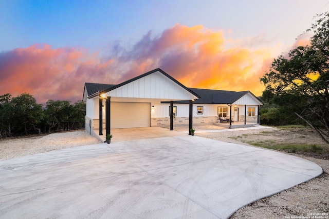 modern inspired farmhouse featuring a garage