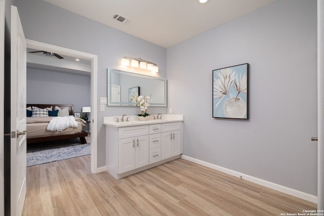 bathroom with vanity and hardwood / wood-style flooring