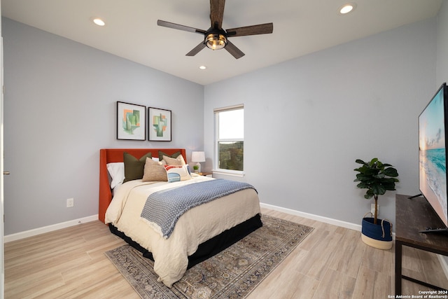 bedroom featuring ceiling fan and light wood-type flooring