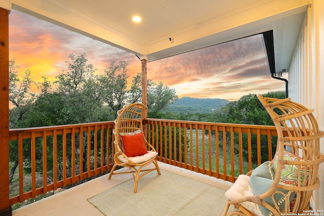 view of balcony at dusk