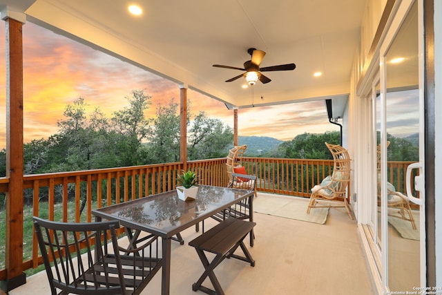 sunroom featuring plenty of natural light and ceiling fan