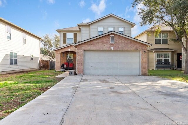 traditional-style home with a garage, concrete driveway, brick siding, and a front yard