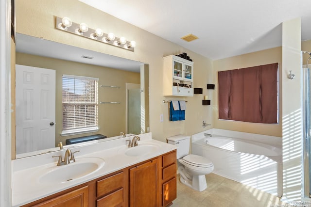 bathroom with visible vents, a sink, toilet, and a bath