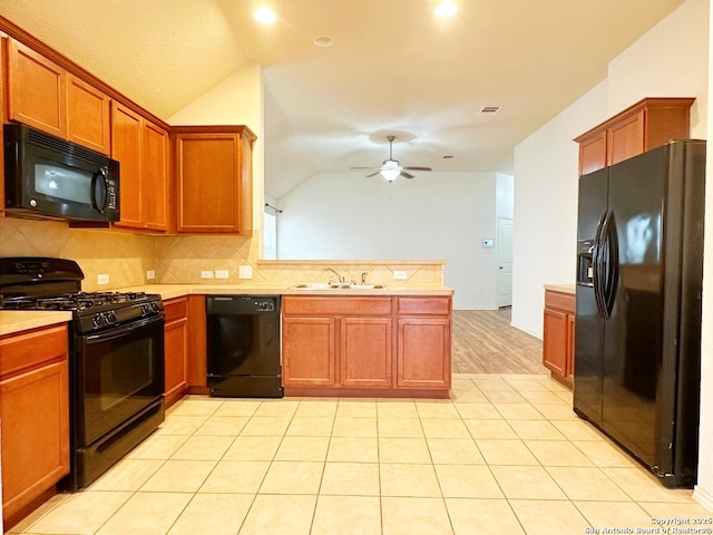 kitchen with vaulted ceiling, sink, backsplash, ceiling fan, and black appliances