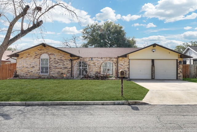 ranch-style house with a garage and a front yard