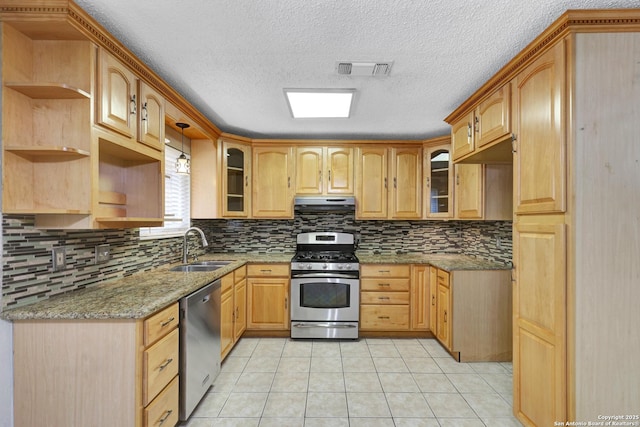 kitchen featuring pendant lighting, sink, stainless steel appliances, light stone counters, and exhaust hood