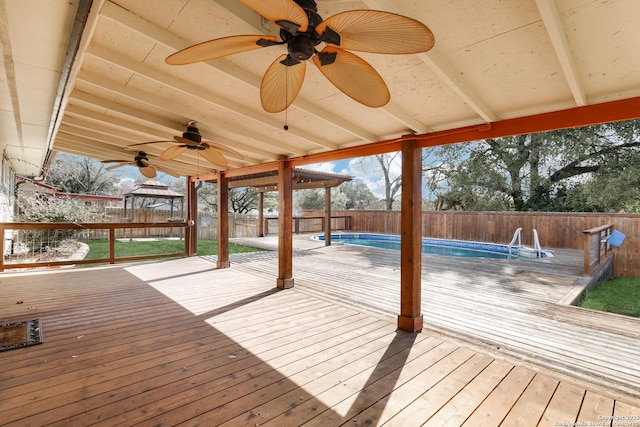 wooden deck featuring a fenced in pool