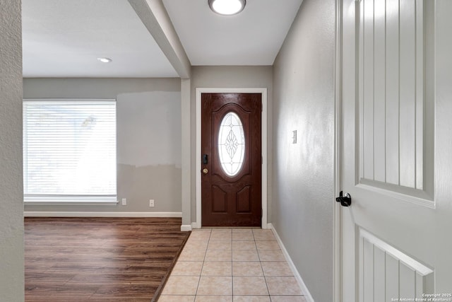 entryway with light hardwood / wood-style flooring and plenty of natural light