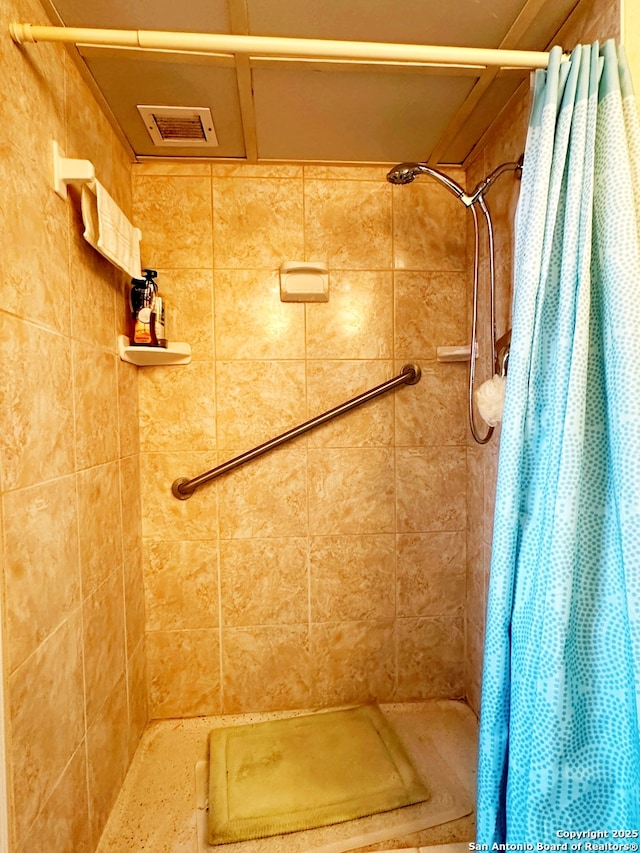 bathroom with a shower with curtain