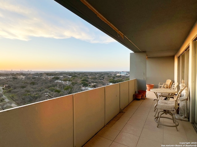 view of balcony at dusk