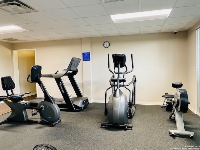 exercise area featuring a paneled ceiling