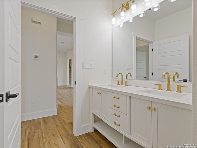 bathroom with wood-type flooring and vanity