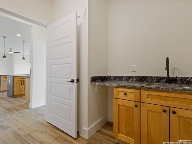 bathroom with sink and hardwood / wood-style floors