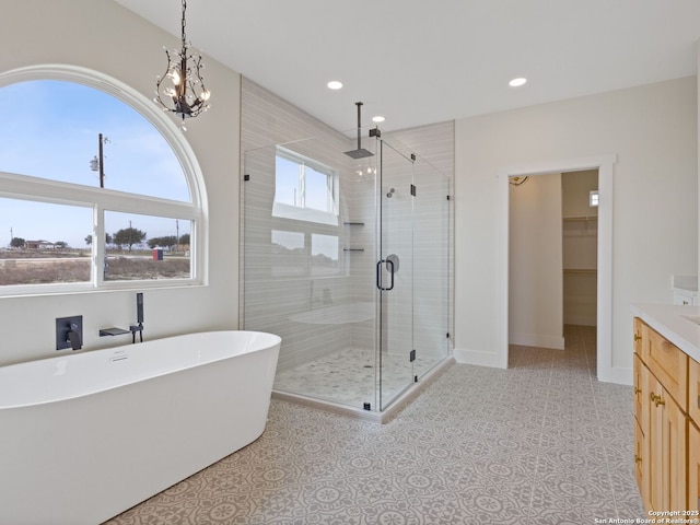 bathroom with vanity, tile patterned floors, and shower with separate bathtub