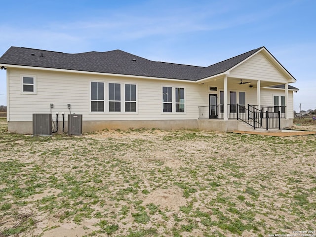 rear view of property with central AC unit and ceiling fan