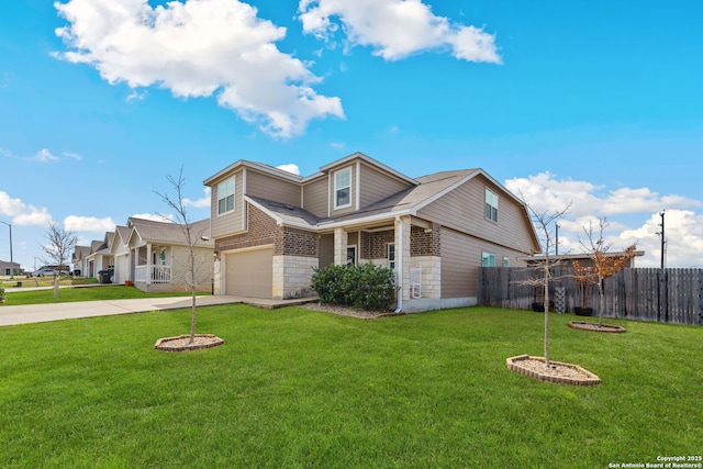 view of front of property with a garage and a front yard