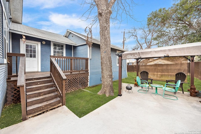 view of patio / terrace featuring an outdoor fire pit