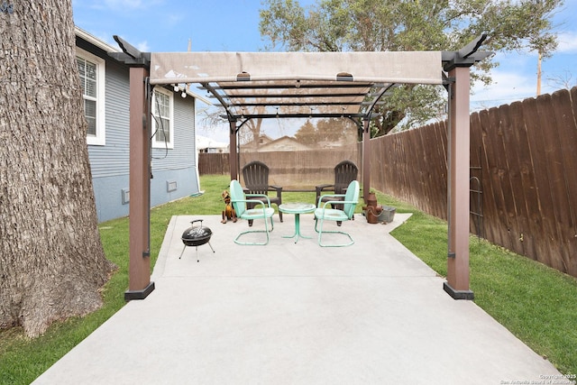 view of patio / terrace with an outdoor fire pit and a pergola