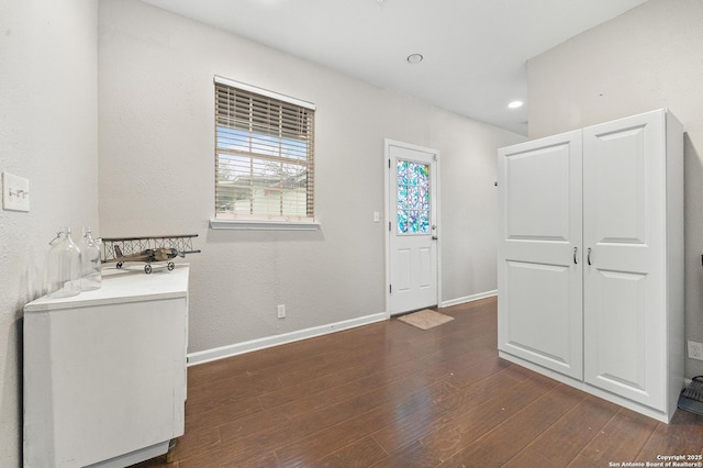 interior space featuring dark wood-type flooring