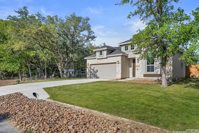 view of front of house with a garage and a front yard