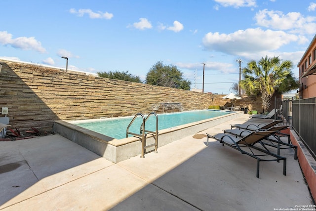 view of swimming pool with a patio area and pool water feature