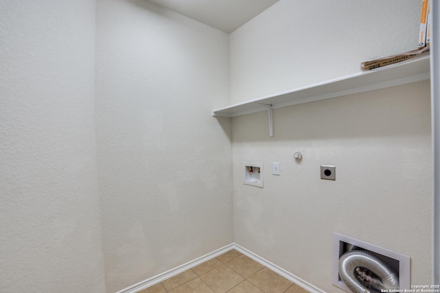 washroom featuring hookup for a washing machine, hookup for a gas dryer, hookup for an electric dryer, and light tile patterned floors