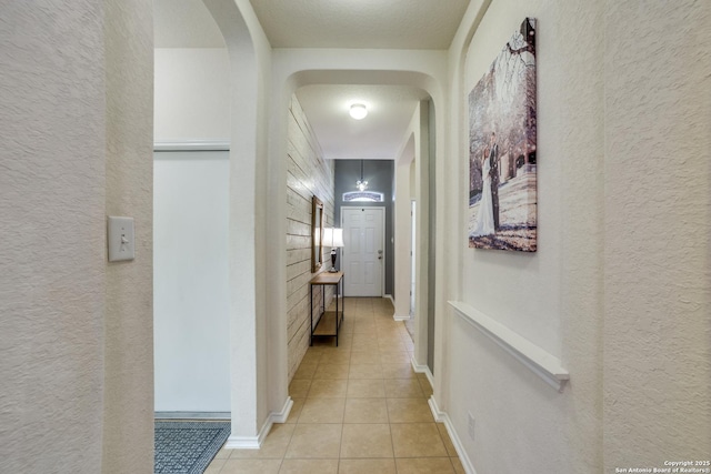 hallway with light tile patterned floors