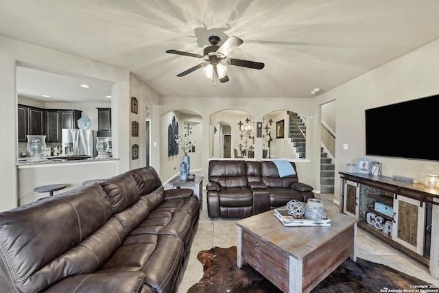 tiled living room featuring ceiling fan