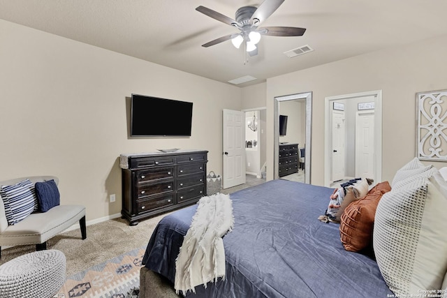 bedroom with ceiling fan and light carpet