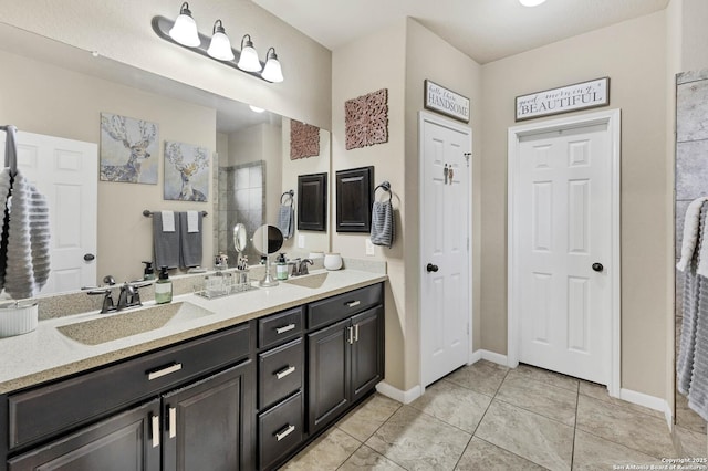 bathroom with tile patterned floors and vanity