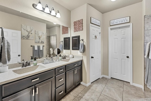 bathroom with vanity and tile patterned floors