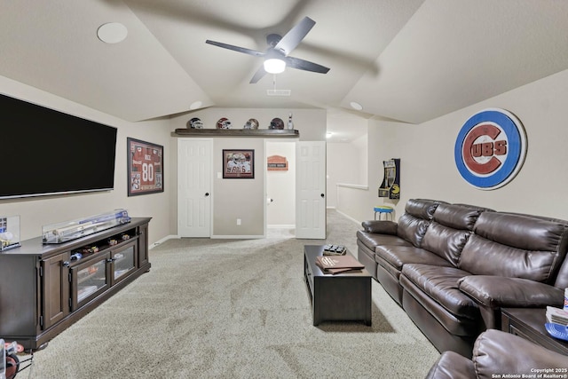 living room with vaulted ceiling, light colored carpet, and ceiling fan