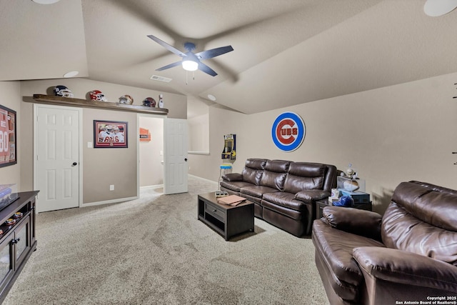 living room with vaulted ceiling, carpet flooring, and ceiling fan