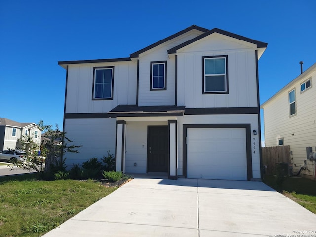 front facade featuring a garage and a front lawn