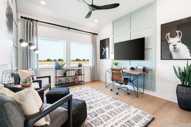 home office featuring lofted ceiling, recessed lighting, a ceiling fan, baseboards, and light wood-type flooring