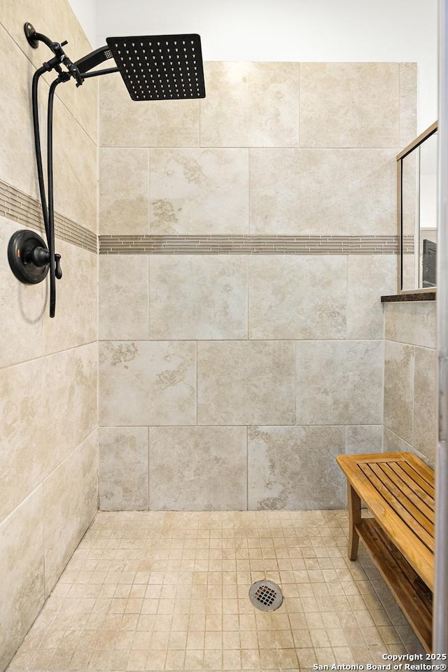 bathroom featuring tiled shower