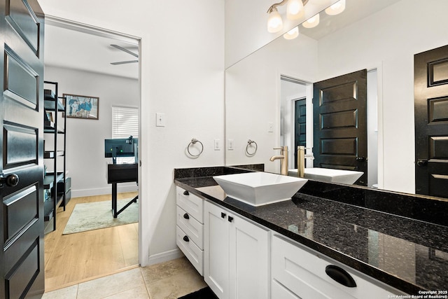 bathroom with tile patterned flooring and vanity