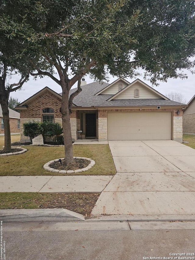 ranch-style home with a garage and a front yard