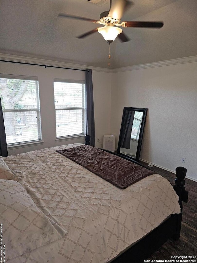 bedroom with crown molding and ceiling fan