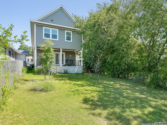 exterior space featuring a porch and a front yard