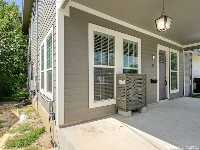 view of exterior entry featuring a patio