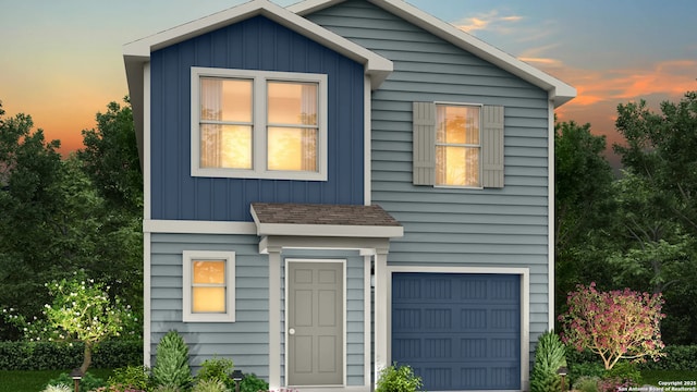310 Mariposa Ln, Kenedy, TX 78119 - view of front facade featuring a garage
