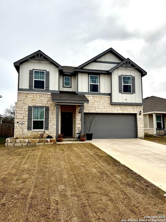 view of front of property with a garage and a front yard