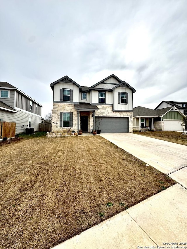 view of front of home featuring a garage and a front lawn