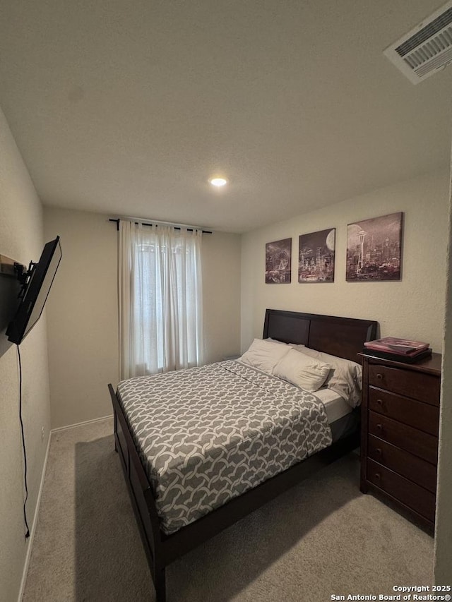 bedroom with light carpet