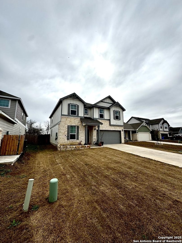 view of front of home featuring a garage and a front yard